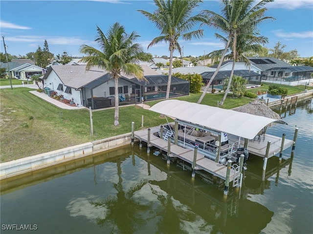 dock area featuring boat lift, a lanai, a water view, a lawn, and an outdoor pool