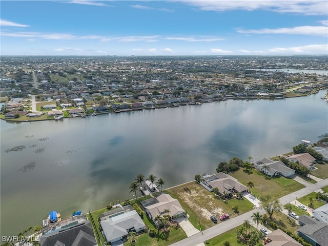 bird's eye view with a water view and a residential view