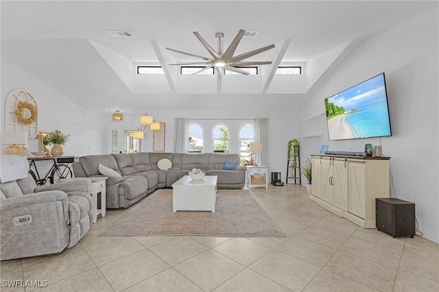 living area featuring high vaulted ceiling, visible vents, and light tile patterned floors