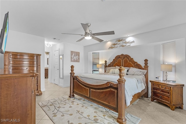 bedroom with light tile patterned floors, baseboards, visible vents, and a ceiling fan