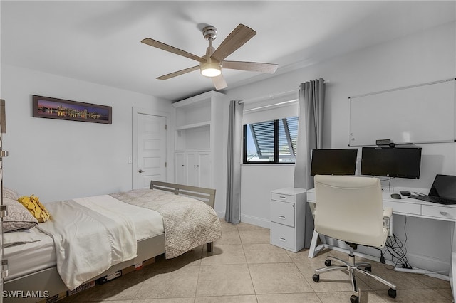 bedroom featuring ceiling fan, light tile patterned flooring, and baseboards