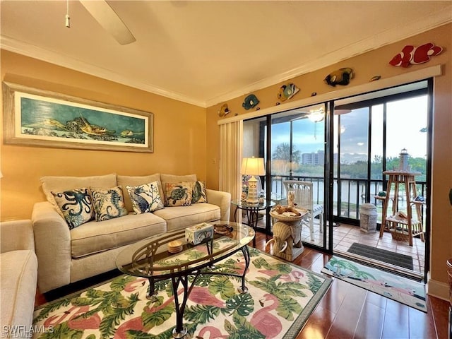 living room featuring ornamental molding and wood finished floors