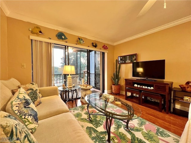 living area with crown molding and wood finished floors