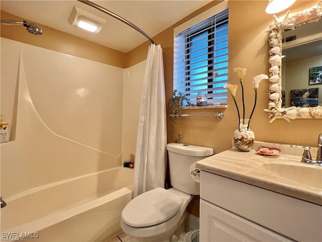 bathroom featuring toilet, shower / bath combo, and vanity