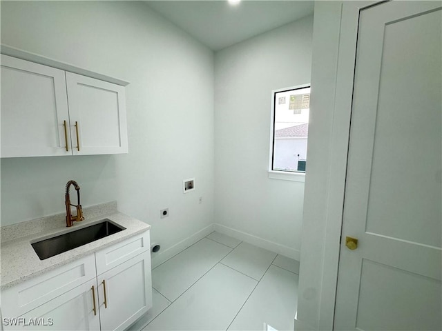 laundry area featuring washer hookup, light tile patterned floors, cabinet space, a sink, and electric dryer hookup