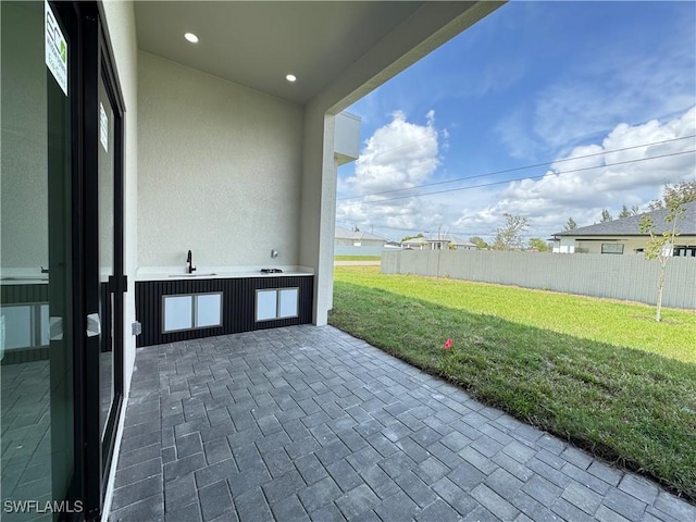 view of patio / terrace with fence