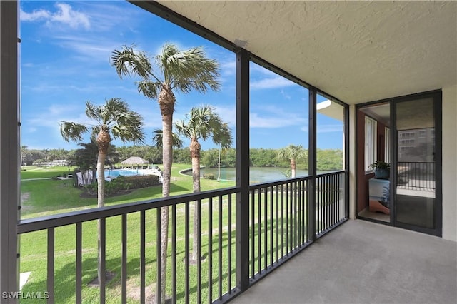 balcony featuring a water view