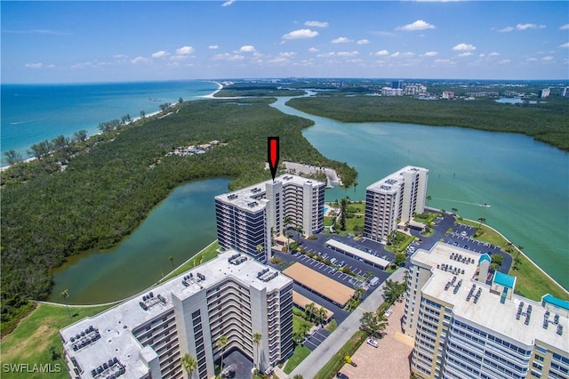 birds eye view of property featuring a water view and a city view