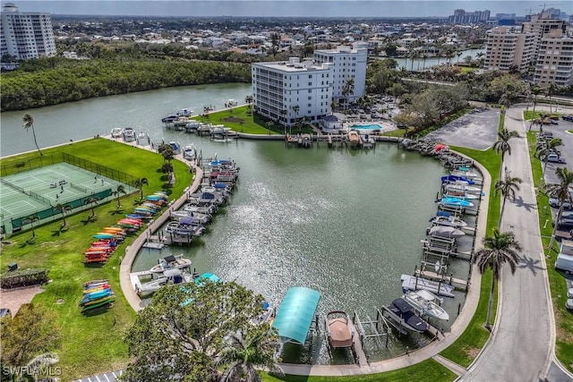 birds eye view of property with a view of city and a water view