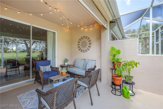 view of patio / terrace featuring glass enclosure and outdoor lounge area