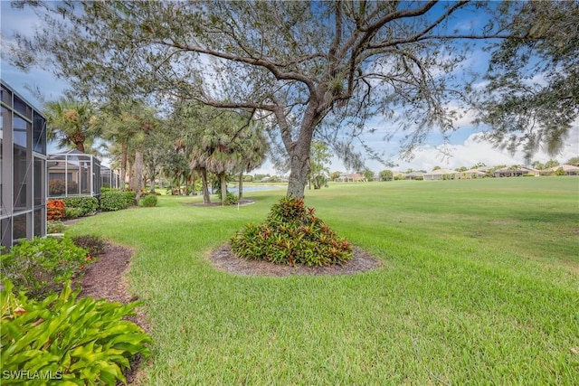 view of yard featuring a lanai