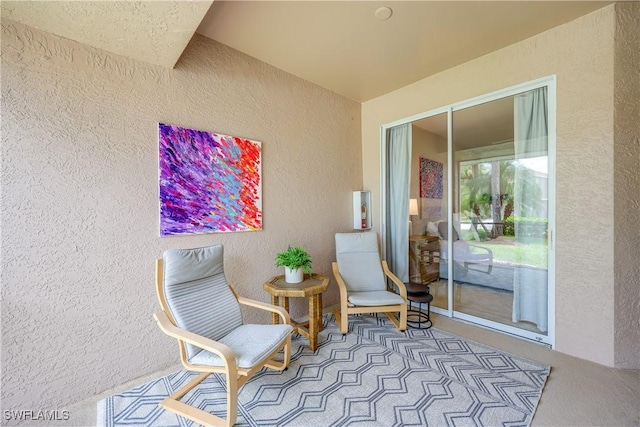 living area featuring a textured wall