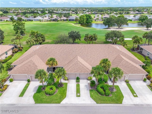 drone / aerial view featuring a water view, a residential view, and golf course view