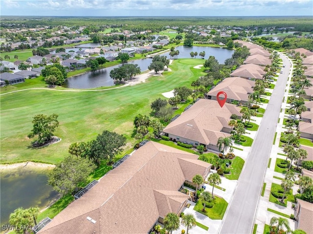 bird's eye view featuring view of golf course, a water view, and a residential view