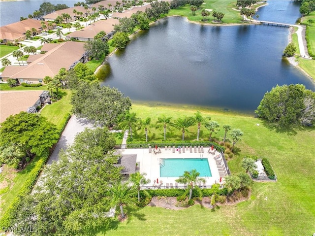 drone / aerial view with a water view and a residential view