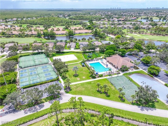 drone / aerial view with a water view and a residential view