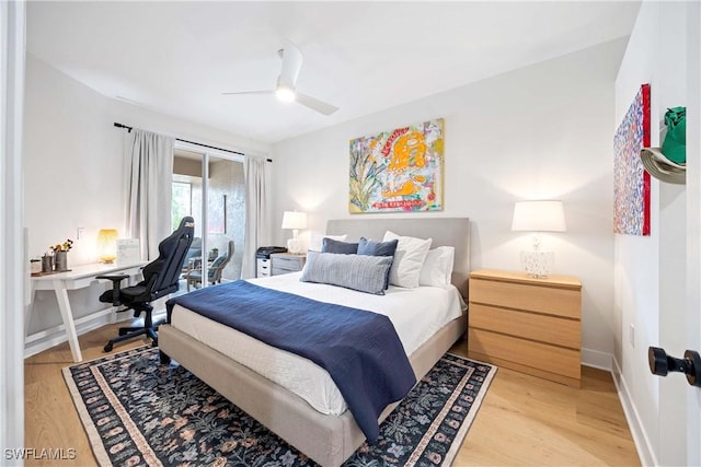 bedroom with a ceiling fan, light wood-type flooring, and baseboards