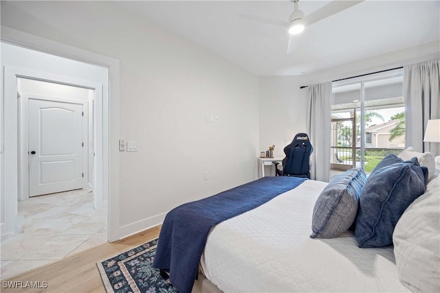 bedroom with access to exterior, light wood-style flooring, baseboards, and a ceiling fan