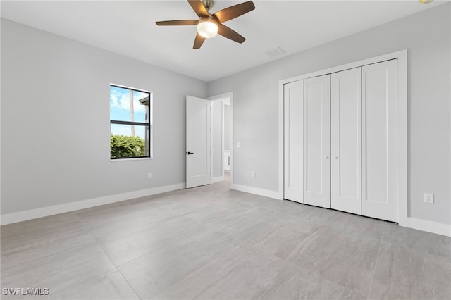 unfurnished bedroom featuring visible vents, baseboards, a closet, and a ceiling fan