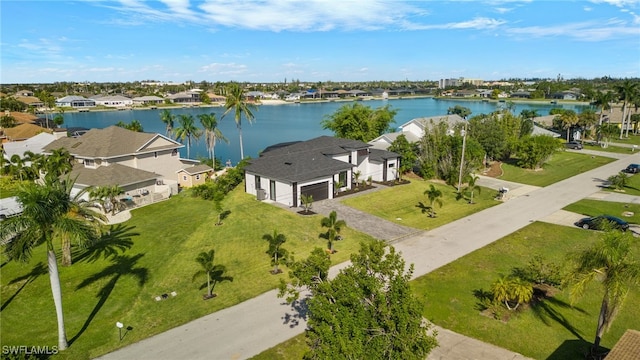 birds eye view of property featuring a residential view and a water view