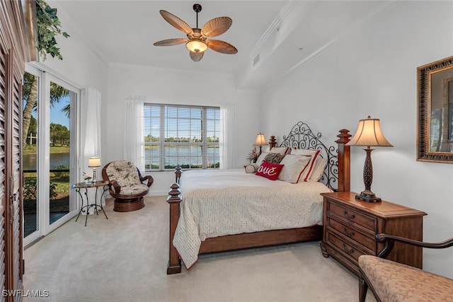 carpeted bedroom with visible vents, a water view, ornamental molding, access to exterior, and ceiling fan