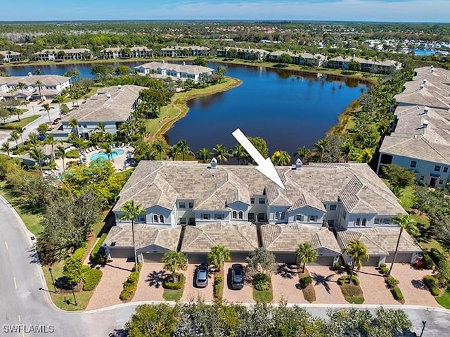 aerial view with a residential view and a water view