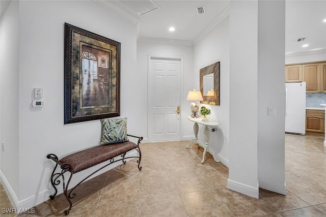 hallway with light tile patterned floors, baseboards, visible vents, recessed lighting, and ornamental molding