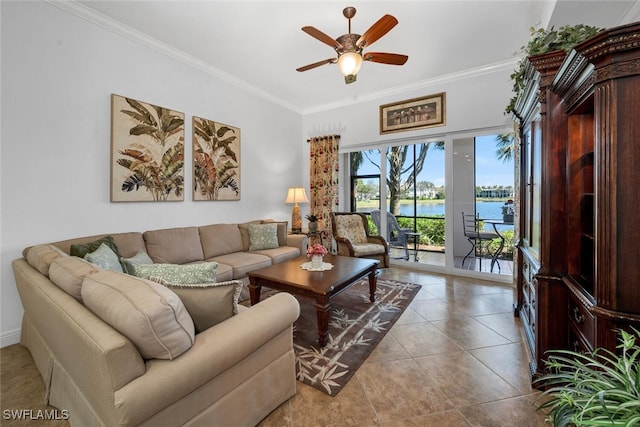 tiled living area with a water view, ornamental molding, and a ceiling fan