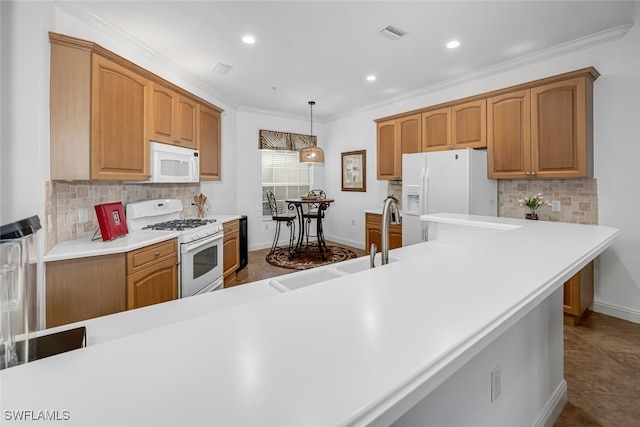 kitchen featuring visible vents, tasteful backsplash, white appliances, crown molding, and light countertops