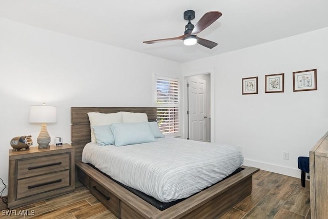 5311 Harborage Dr, Fort Myers, FL 33908 - bedroom with dark wood-style floors, baseboards, and a ceiling fan