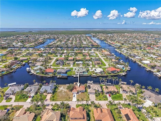 birds eye view of property featuring a residential view and a water view