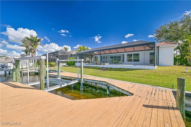 view of dock with a lanai, a water view, boat lift, and a lawn