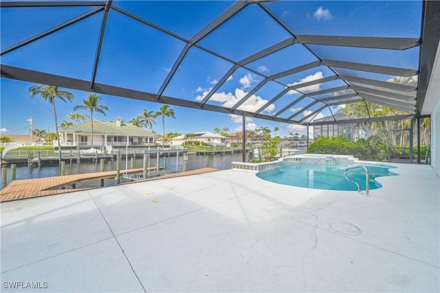 outdoor pool with boat lift, a water view, a patio area, glass enclosure, and a dock