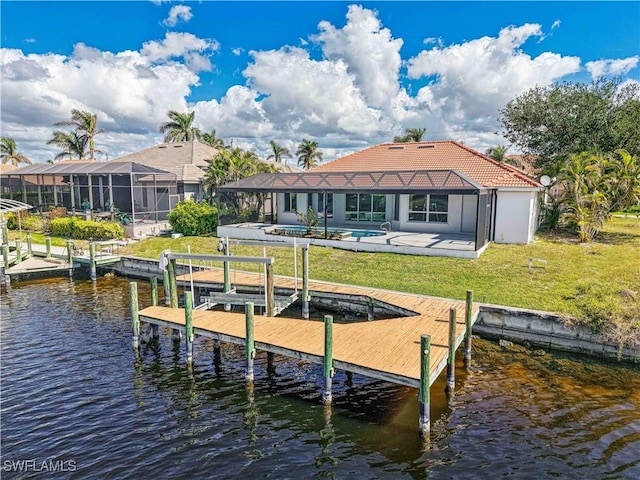 view of dock with a yard, a patio, a water view, glass enclosure, and an outdoor pool