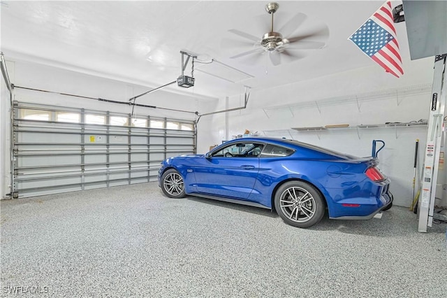 garage featuring a ceiling fan and a garage door opener