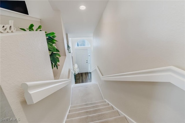stairway with recessed lighting, carpet floors, and baseboards
