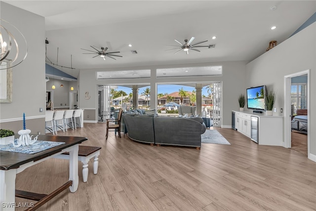 living area with visible vents, light wood-style floors, and ceiling fan