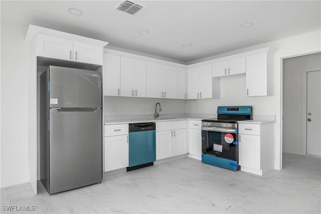 kitchen featuring marble finish floor, stainless steel appliances, light countertops, and visible vents