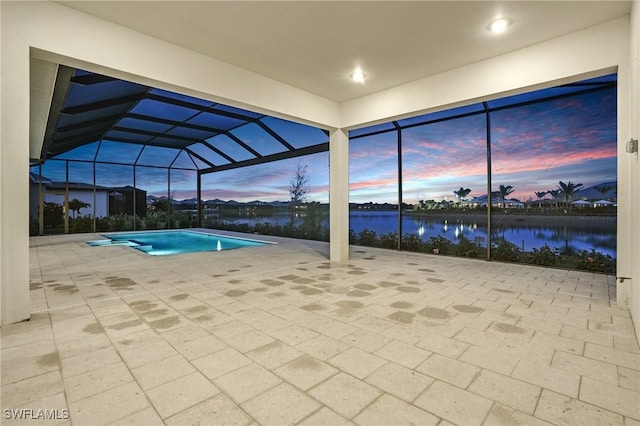 view of pool with a water view