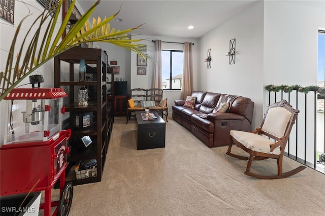 carpeted living area with recessed lighting