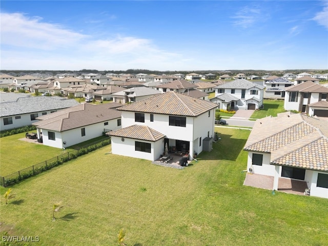 birds eye view of property with a residential view