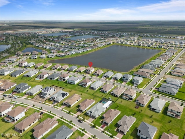 birds eye view of property featuring a residential view and a water view