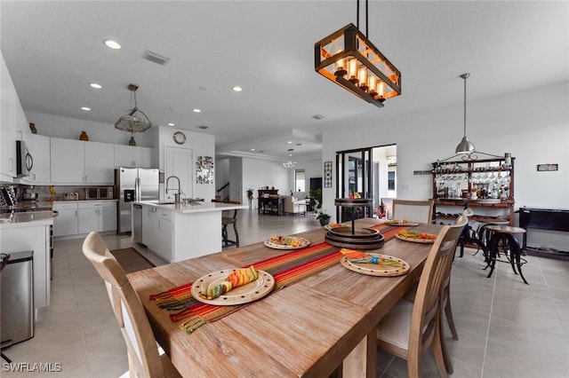 dining area featuring an inviting chandelier, recessed lighting, visible vents, and light tile patterned flooring