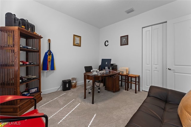 office with baseboards, visible vents, and carpet flooring