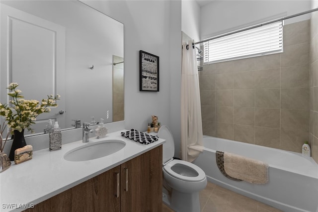 bathroom with toilet, shower / bath combo, vanity, and tile patterned floors