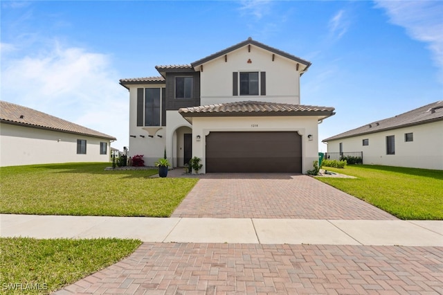 mediterranean / spanish-style house with a garage, a tiled roof, decorative driveway, a front lawn, and stucco siding