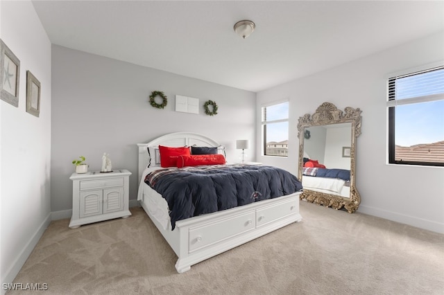 bedroom featuring carpet flooring and baseboards