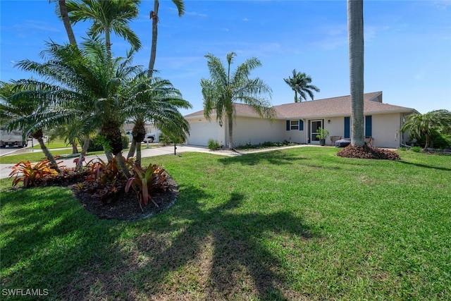 4440 Beechwood Lake Dr, Naples, FL 34112 - ranch-style home featuring a garage, a front lawn, concrete driveway, and stucco siding