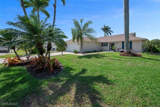 ranch-style home featuring a garage, a front lawn, concrete driveway, and stucco siding