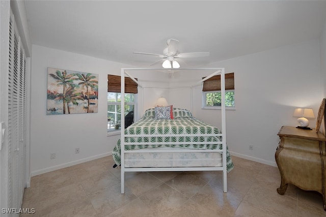 bedroom featuring a ceiling fan and baseboards